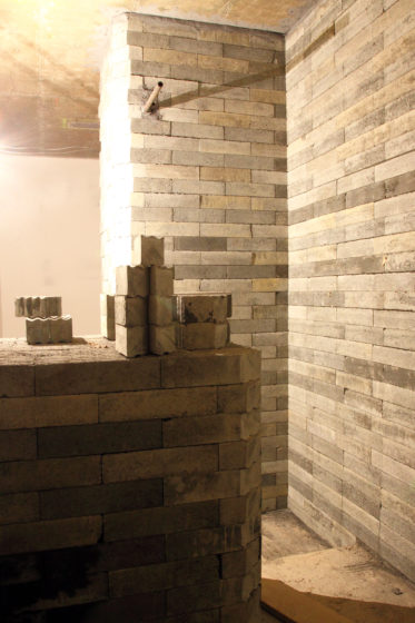 A wall built with concrete based lead-free bricks, for radiation shielding