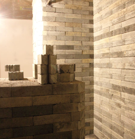 A wall built with concrete based lead-free bricks, for radiation shielding