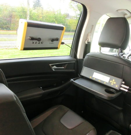 A flexible mobile radiation monitor installed onto a car's window