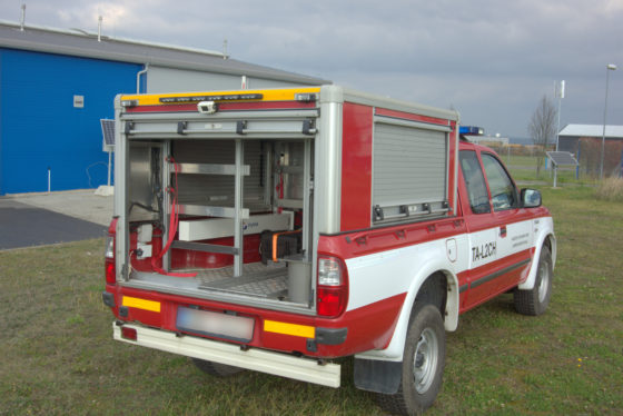 A vehicle with a radiation monitoring system fixed inside of it