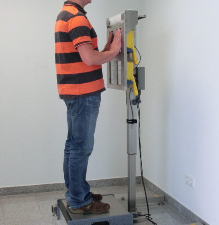 A man using an emergency contamination monitor