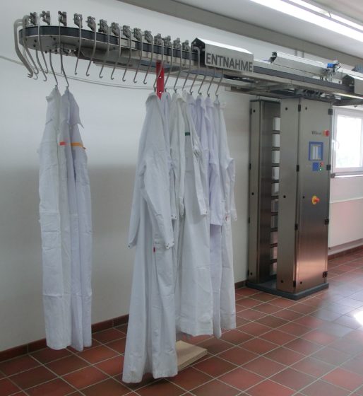 Clothes hung on a laundry contamination monitor for radiations with a running rail system