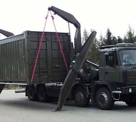 A truck installs a mobile radiochemistry laboratory