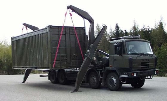 A truck installs a mobile radiochemistry laboratory