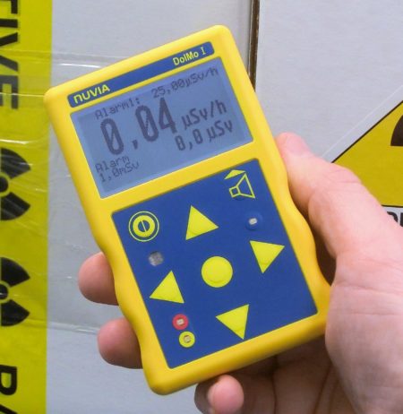 dose and dose rate monitor held into a hand