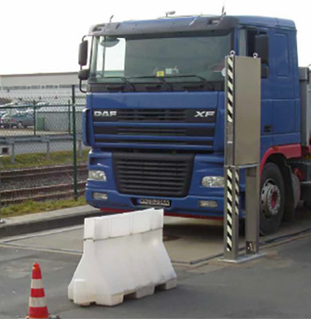 A truck crossing a radioactivity monitor on a road