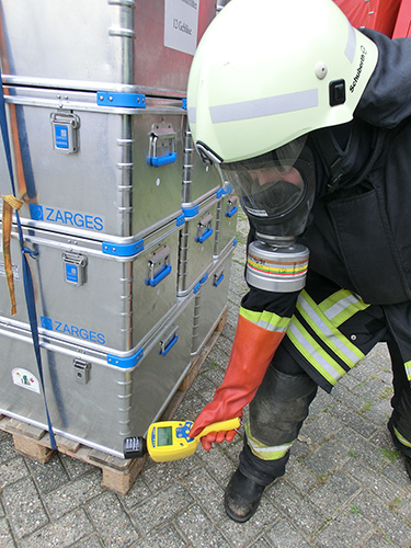A fireman monitoring radioactive goods