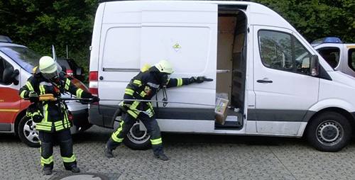 Firemen monitoring a vehicle